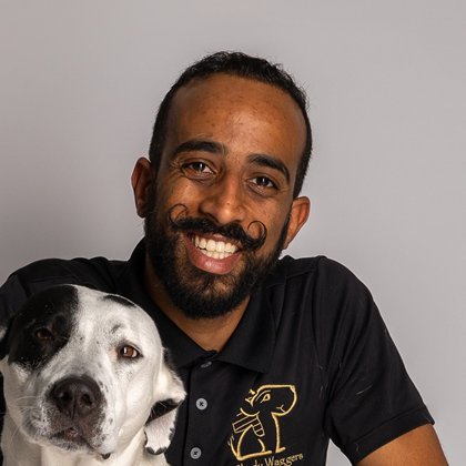 Shady, founder of Shady Waggers, with his dog Moo